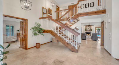 A home in Paradise Park Manor at McCormick Ranch, featuring a staircase leading to a large living room.