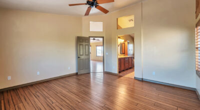 A home in McDowell Mountain Ranch, Scottsdale Arizona with wood floors and a ceiling fan.