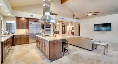 A large kitchen with a large island and a ceiling fan in the Paradise Park Manor neighborhood at McCormick Ranch.