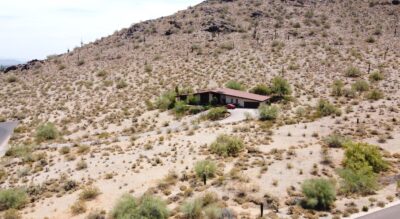 An aerial view of a house in the desert located at 4343 E Fanfol Drive, Phoenix, AZ.