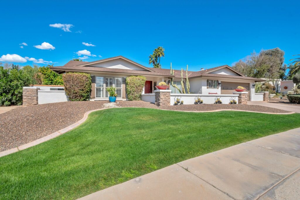 A McCormick Ranch home with green grass in the front yard.