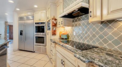 A kitchen with marble counter tops and stainless steel appliances in McCormick Ranch.