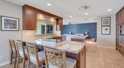 Modern kitchen with a breakfast bar and granite countertops located at 6309 E Friess Dr, Scottsdale.
