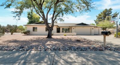 Single-story Scottsdale house with a large tree and front yard at 6309 E Friess Dr, Scottsdale