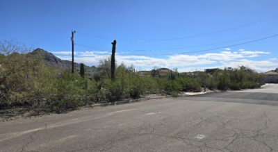 A paved road alongside a lot able to be split into four new lots near Piestawa Peak.